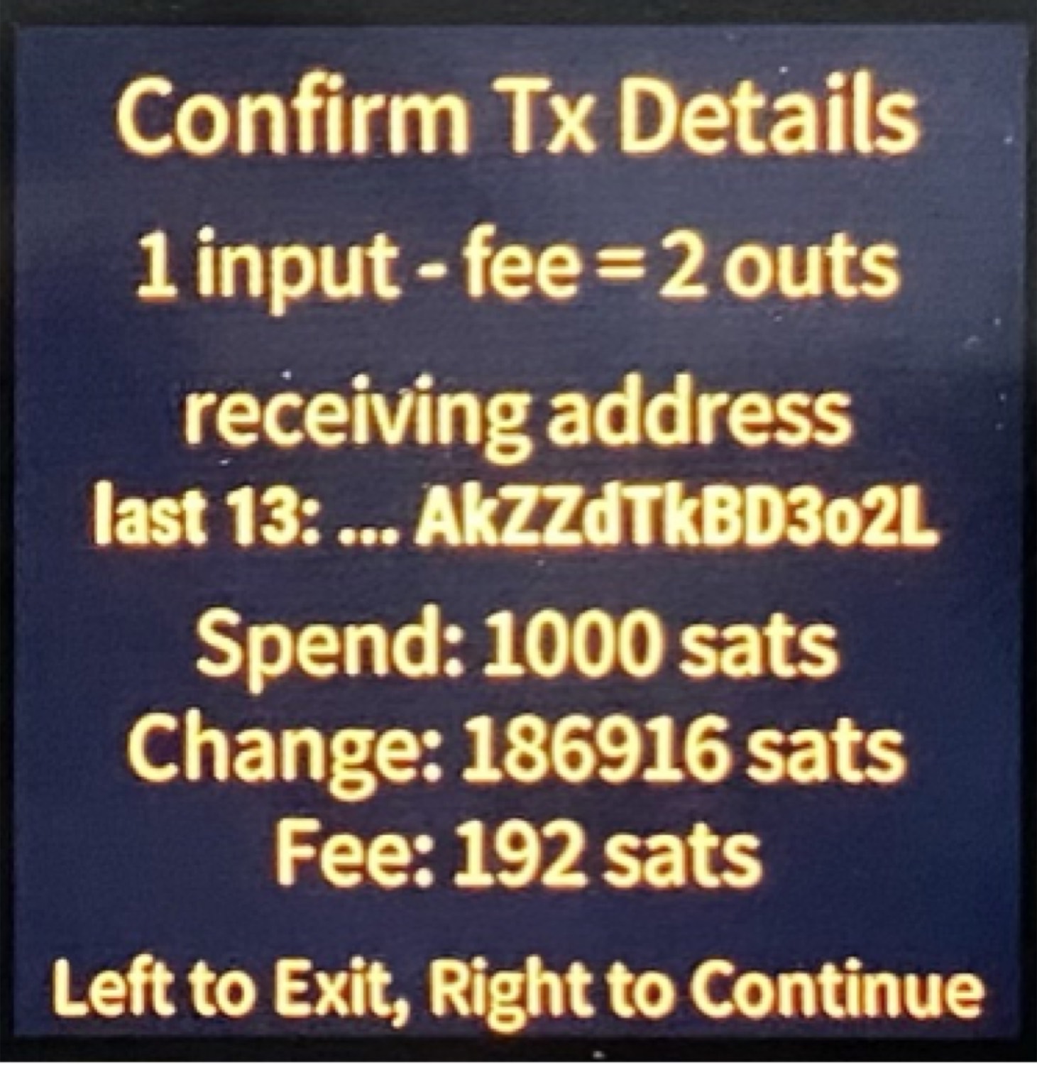 A SeedSigner screen headed Confirm Tx Details, listing one input minus fee equals two outputs, the last 13 characters of the receiving address, spend, change and fee amounts in sats