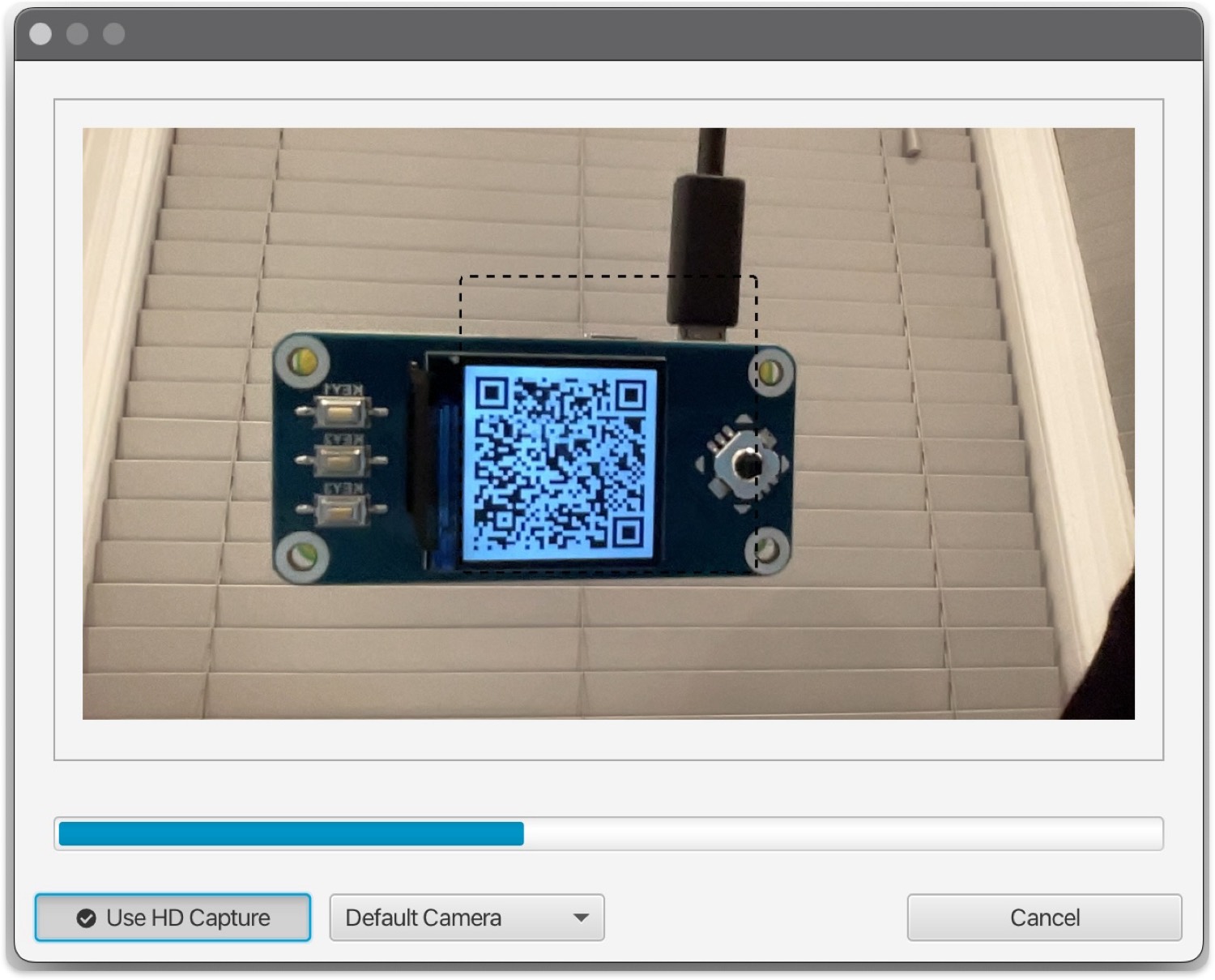 Sparrow's webcam preview scanning a QR code displayed on a SeedSigner screen